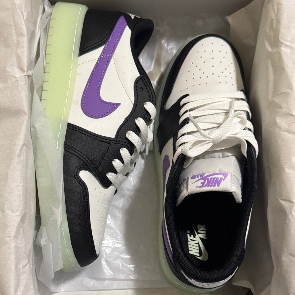Nike Air Black and Purple glow-in-the-dark sneakers with White accents.